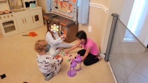 Three children playing on floor