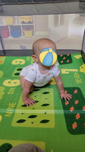 Baby playing in playpen