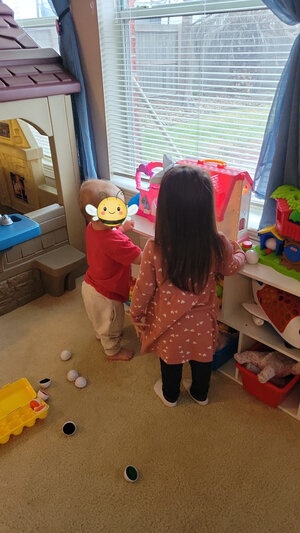 Girl and baby playing together