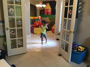 Child dancing in doorway