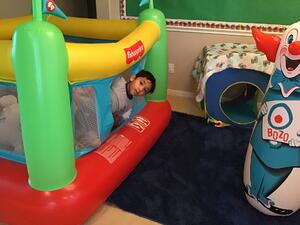 Child in bounce house